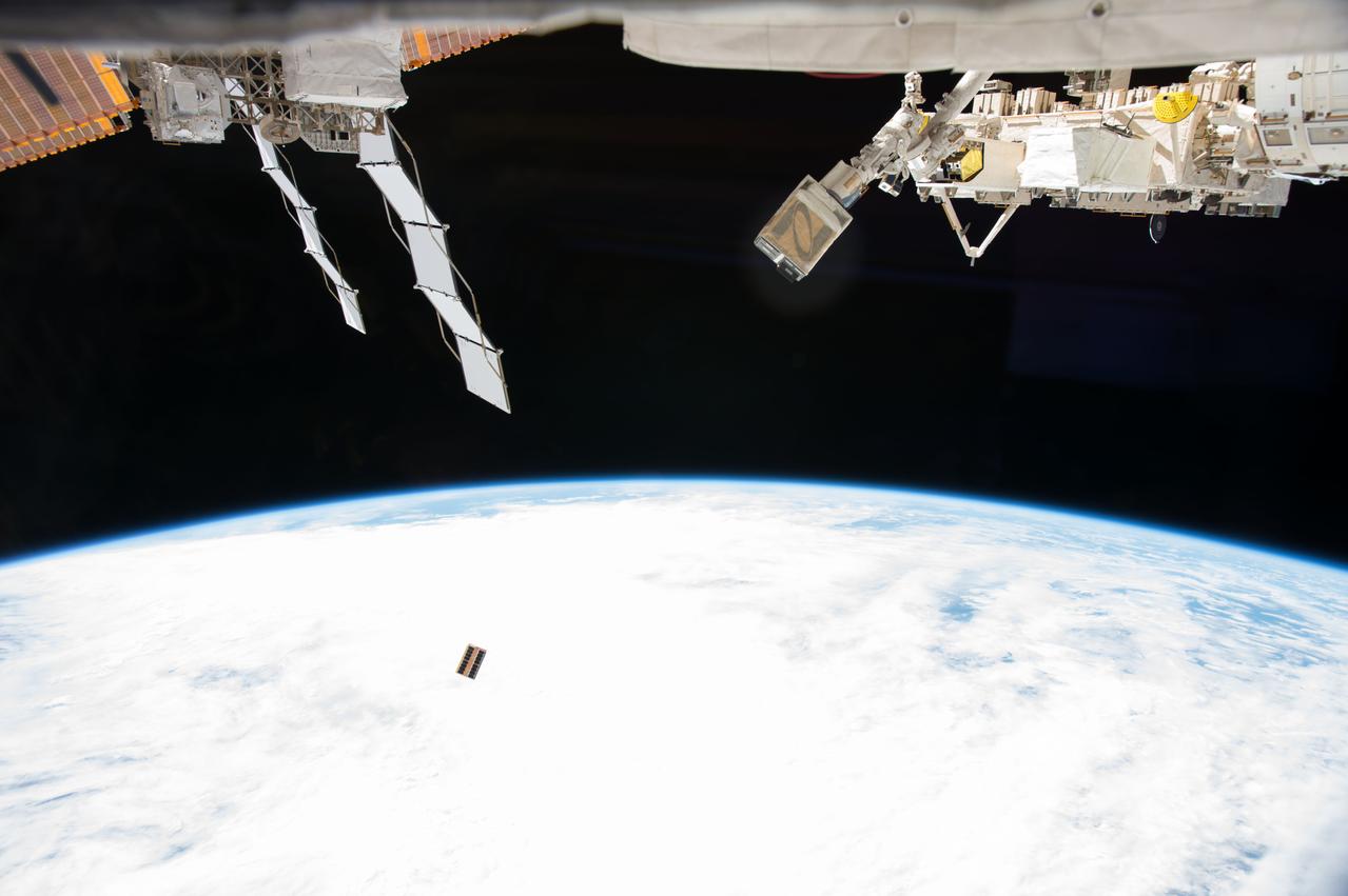 iss053e215867 (Nov. 20, 2017) --- The EcAMSat, short for E. coli AntiMicrobial Satellite, is seen moments after being ejected from the NanoRacks CubeSat Deployer attached to the outside of Kibo laboratory module from the Japan Aerospace Exploration Agency. The E. coli AntiMicrobial Satellite (EcAMSat) mission will investigate space microgravity effects on the antibiotic resistance of E. coli, a bacterial pathogen responsible for urinary tract infection in humans and animals.