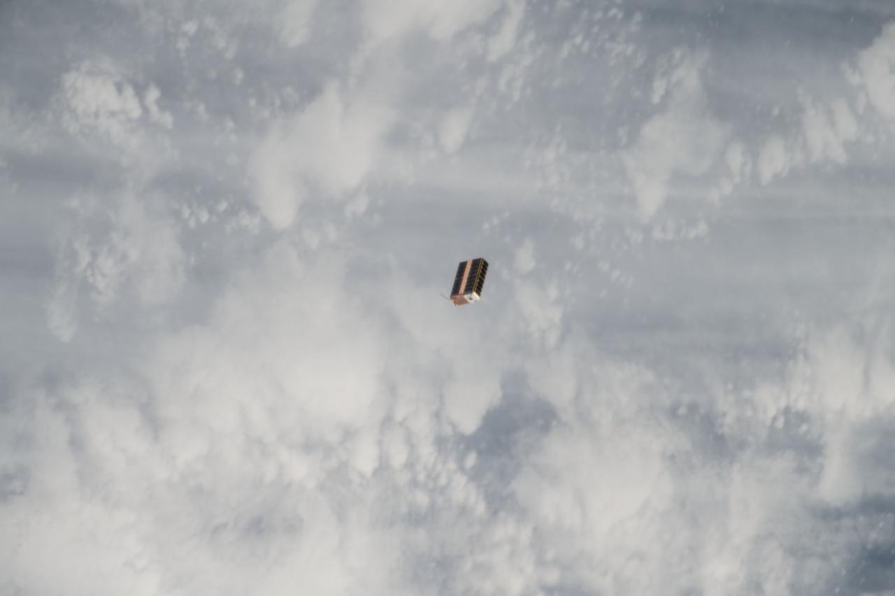 iss053e216632 (Nov. 20, 2017) --- The EcAMSat, short for E. coli AntiMicrobial Satellite, is seen moments after being ejected from the NanoRacks CubeSat Deployer attached to the outside of Kibo laboratory module from the Japan Aerospace Exploration Agency. The E. coli AntiMicrobial Satellite (EcAMSat) mission will investigate space microgravity effects on the antibiotic resistance of E. coli, a bacterial pathogen responsible for urinary tract infection in humans and animals.