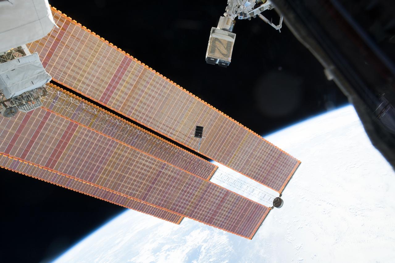 iss053e235238(11/20/2017) --- A view of the Dellingr/RBLE Satellite deployment from the NanoRacks CubeSate Deployer Number 13 aboard the International Space Station (ISS). Dellingr/RBLE expands understanding of space weather risk by establishing baseline estimates of magnetic variation and particle fluxes in the exosphere. The instrument also observes cause and effect relationships between solar events and Earth’s atmosphere, which advances fundamental understanding of electromagnetic dynamics in the space environment.