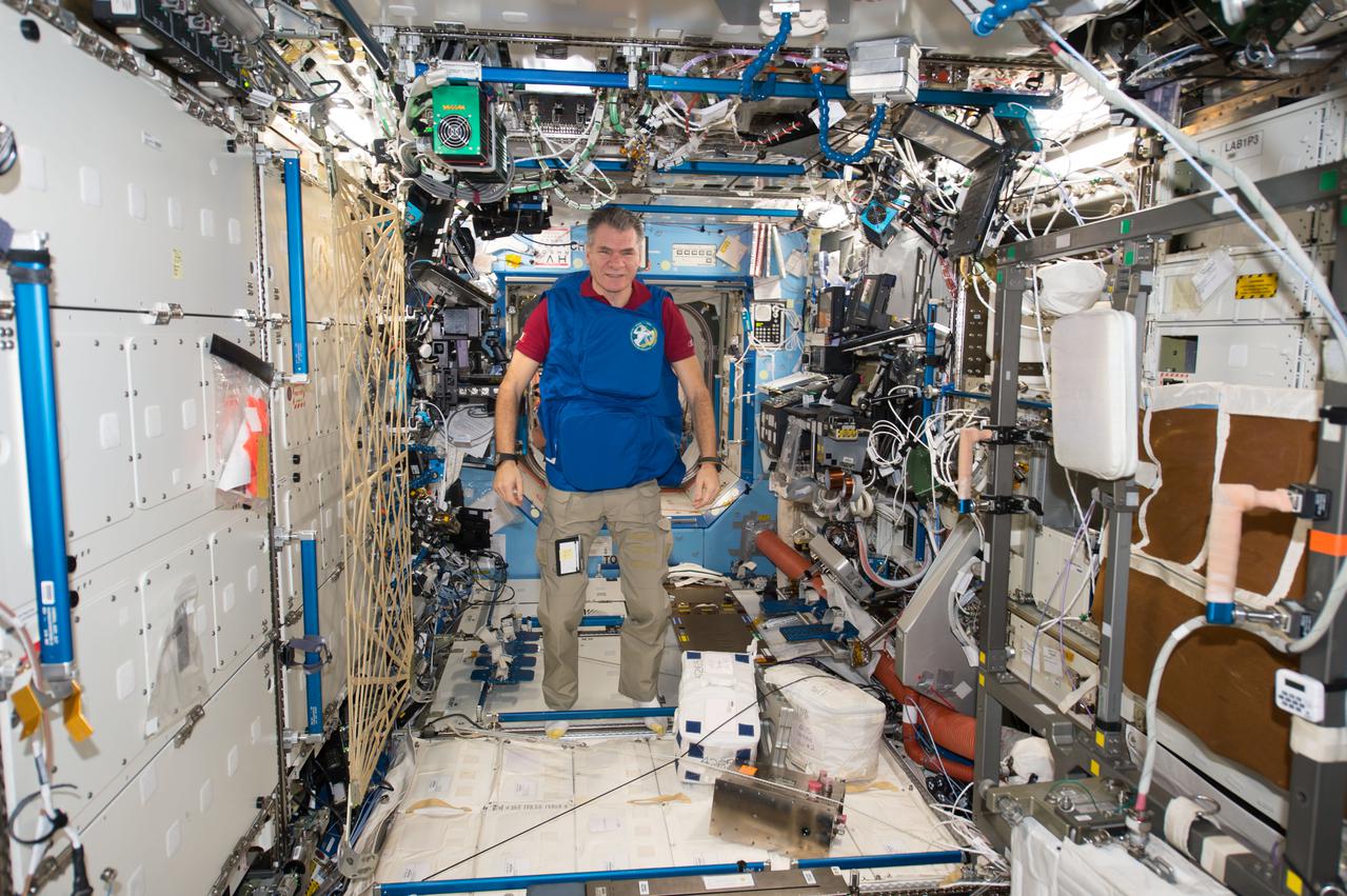 iss053e238886 (Nov. 7, 2017) --- Expedition 53 Flight Engineer Paolo Nespoli, from the European Space Agency, tests a personal radiation shielding garment. Water is used for its shielding properties and filled inside garment containers covering organs that are especially sensitive to cosmic radiation.