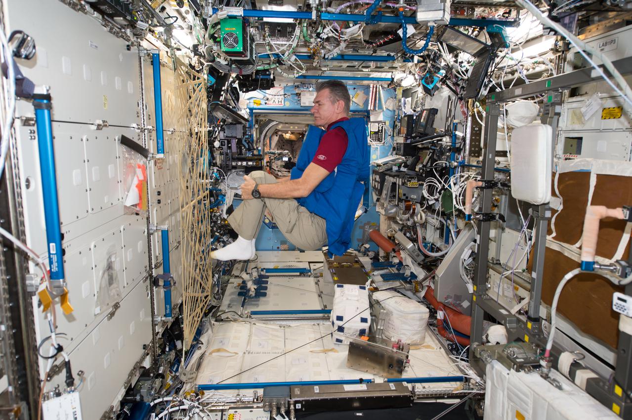 iss053e238888 (Nov. 7, 2017) --- Expedition 53 Flight Engineer Paolo Nespoli, from the European Space Agency, tests a personal radiation shielding garment. Water is used for its shielding properties and filled inside garment containers covering organs that are especially sensitive to cosmic radiation.