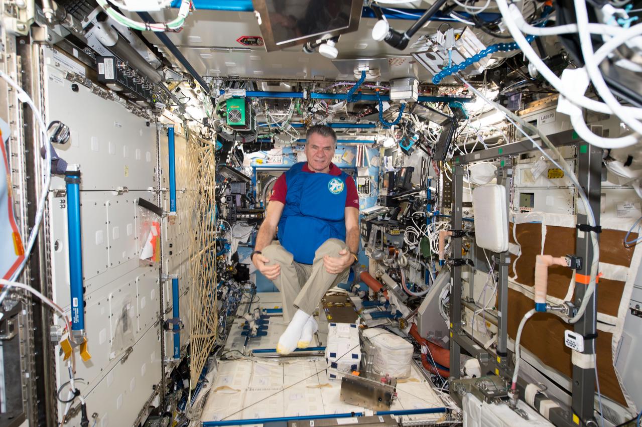 iss053e238891 (Nov. 7, 2017) --- Expedition 53 Flight Engineer Paolo Nespoli, from the European Space Agency, tests a personal radiation shielding garment. Water is used for its shielding properties and filled inside garment containers covering organs that are especially sensitive to cosmic radiation.
