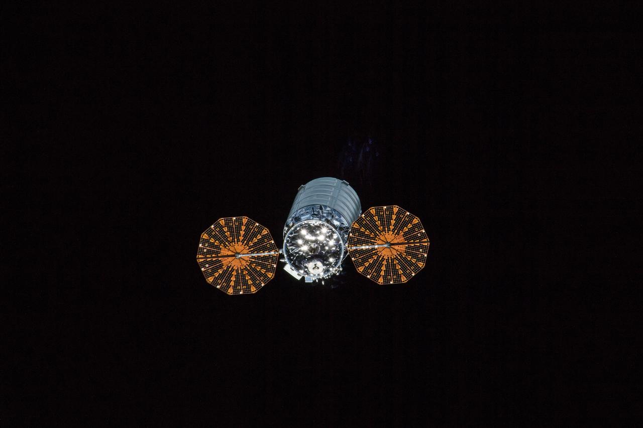 iss053e317726 (Dec. 5, 2017) --- The Cygnus spacecraft with its cymbal-like UltraFlex solar arrays deployed was pictured departing the space station Dec. 5, 2017 during Expedition 53.
