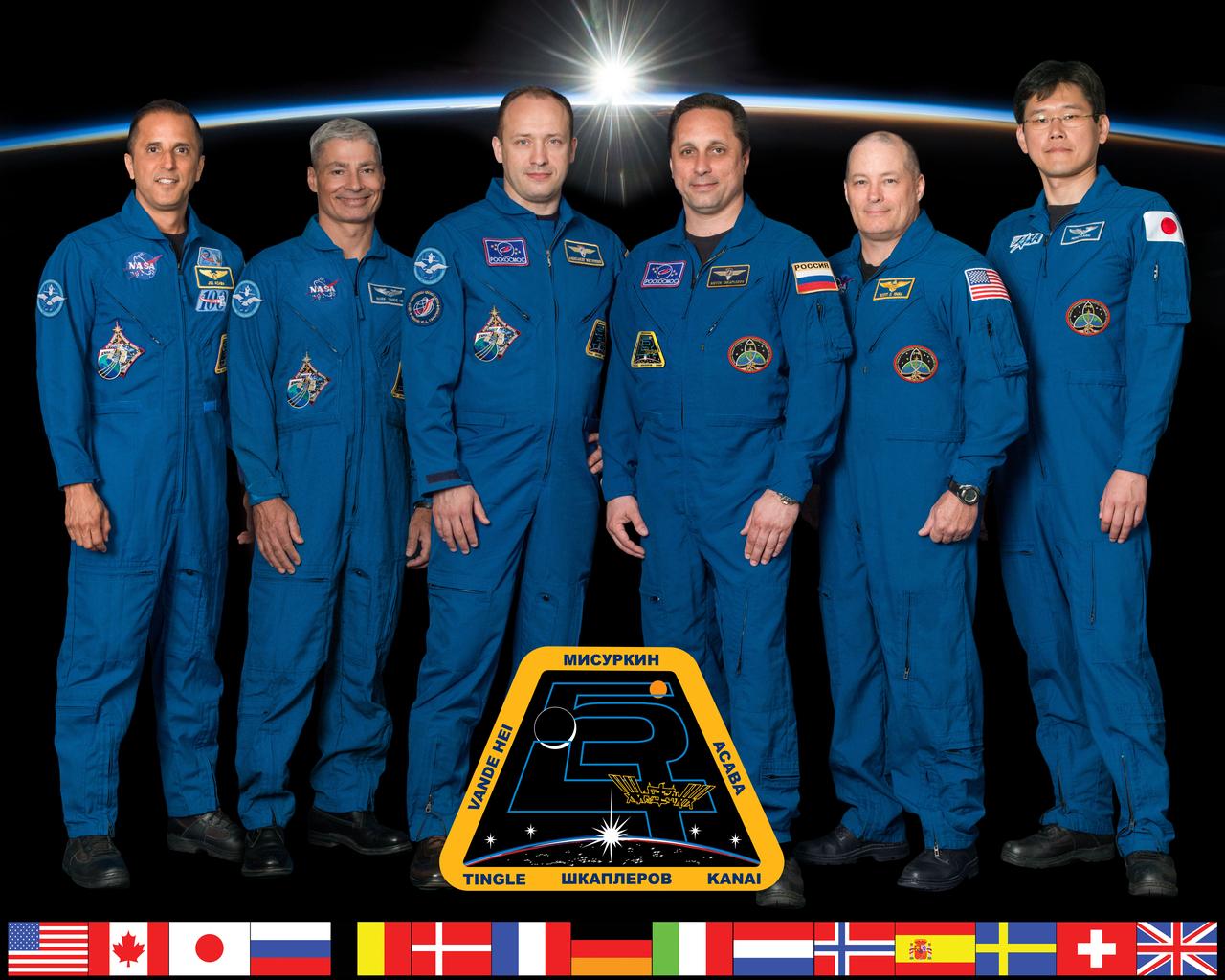 iss054-s-002 (May 8, 2017) --- The six-member Expedition 54 crew poses for an official crew portrait at the Johnson Space Center in Houston, Texas. From left are Flight Engineers Joe Acaba and Mark Vande Hei of NASA, Commander Alexander Misurkin of Roscosmos and Flight Engineers Anton Shkaplerov of Roscosmos, Scott Tingle of NASA and Norishige Kanai of the Japan Aerospace Exploration Agency.