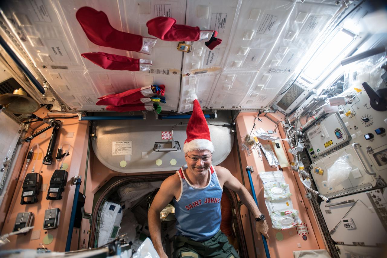 iss054e005591 (Dec. 24, 2017) --- NASA astronaut Mark Vande Hei "stirs" in the orbital house that is the International Space Station on Christmas Eve.