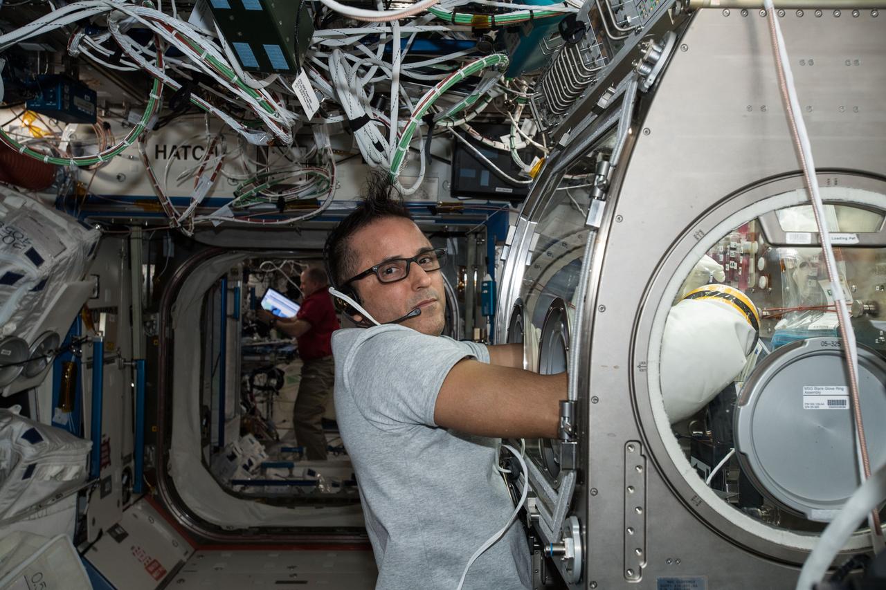 iss054e006421 912/21/2017) --- NASA astronaut Joe Acaba conducts fluid exchange and sampling for the Synthetic Bone experiment inside the Microgravity Science Glovebox (MSG) in the Destiny U.S. Laboratory aboard the International Space Station (ISS).Synthetic Bone tests the functionality and effectiveness of a new material that can assist in recovery from bone injuries or dental work during long-term space travel.
