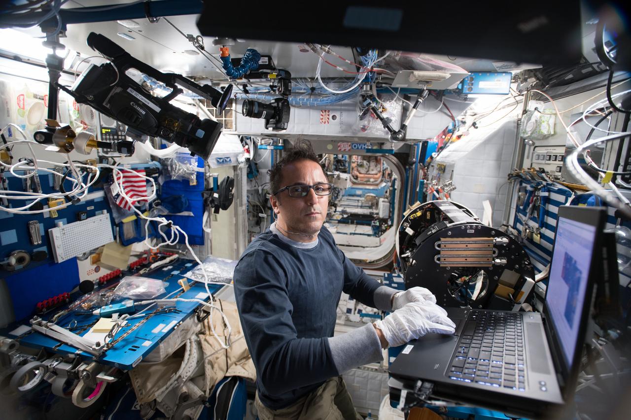 iss054e014673 (Jan. 5, 2018) --- Astronaut Joe Acaba works on wire connections and other maintenance tasks inside Combustion Integrated Rack gear.