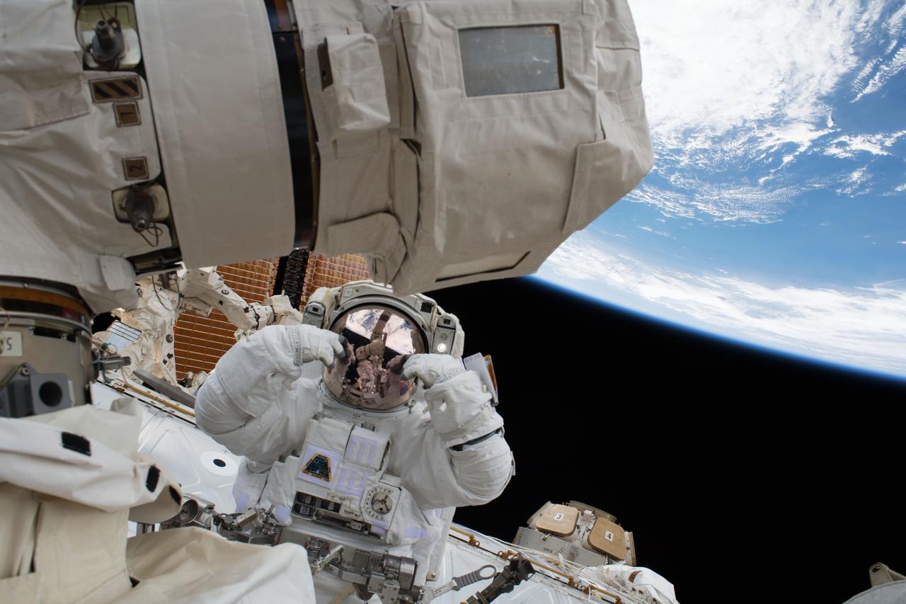 iss054e022826 (Jan. 23, 2018) --- NASA astronaut Scott Tingle is pictured during a spacewalk to swap out a degraded robotic hand, or Latching End Effector, on the Canadarm2. NASA astronaut Mark Vande Hei also participated in the robotics maintenance spacewalk.