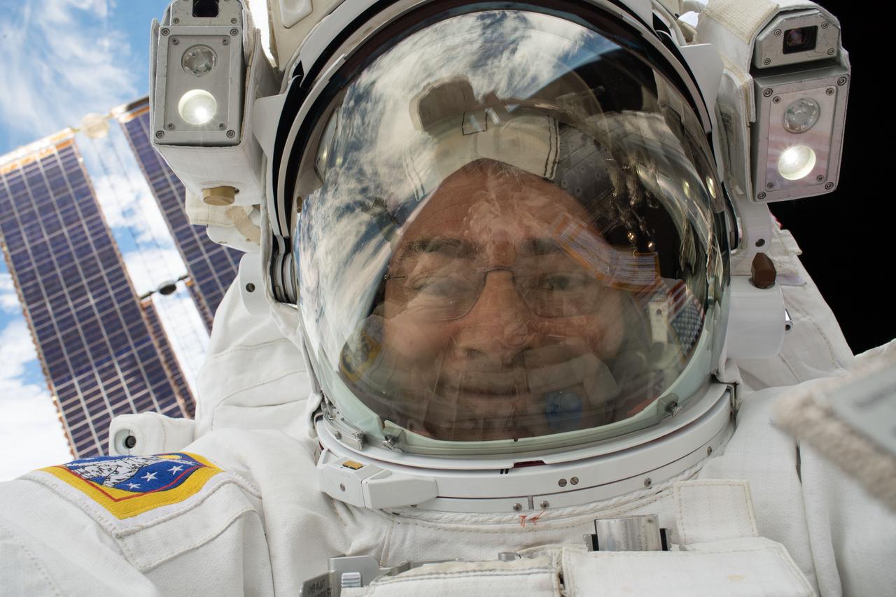 iss054e022850 (Jan. 23, 2018) --- NASA astronaut Mark Vande Hei photographed himself with his helmet visor up during a spacewalk that took place on Jan. 23, 2018. Though less dramatic than a selfie with the reflective visor down this picture could still be considered a "space-selfie." He and NASA astronaut Scott Tingle spent seven hours and 24 minutes working outside the International Space Station for maintenance on the Canadarm2 robotic arm.