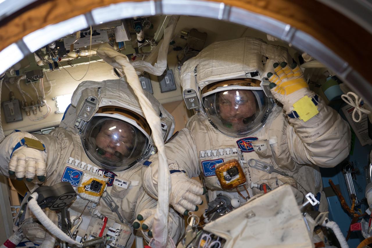 iss054e026563 (Jan. 31, 2018) --- Cosmonauts Alexander Misurkin (left) and Anton Shkaplerov are pictured in their Russian Orlan spacesuits during a fit check ahead of a Feb.2 spacewalk for International Space Station maintenance.