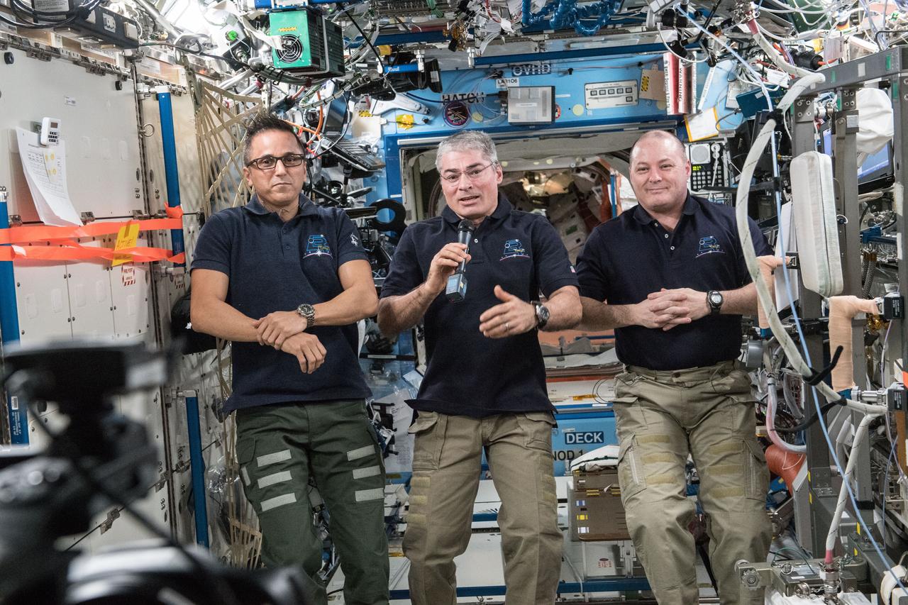 iss054e037647 (Feb. 8, 2018) --- NASA astronauts (from left) Joe Acaba, Mark Vande Hei and Scott Tingle talk to high school students and teachers who linked up to the International Space Station during a STEM (Science, Technology, Engineering and Mathematics) event from the Boise State University in Boise, Idaho.