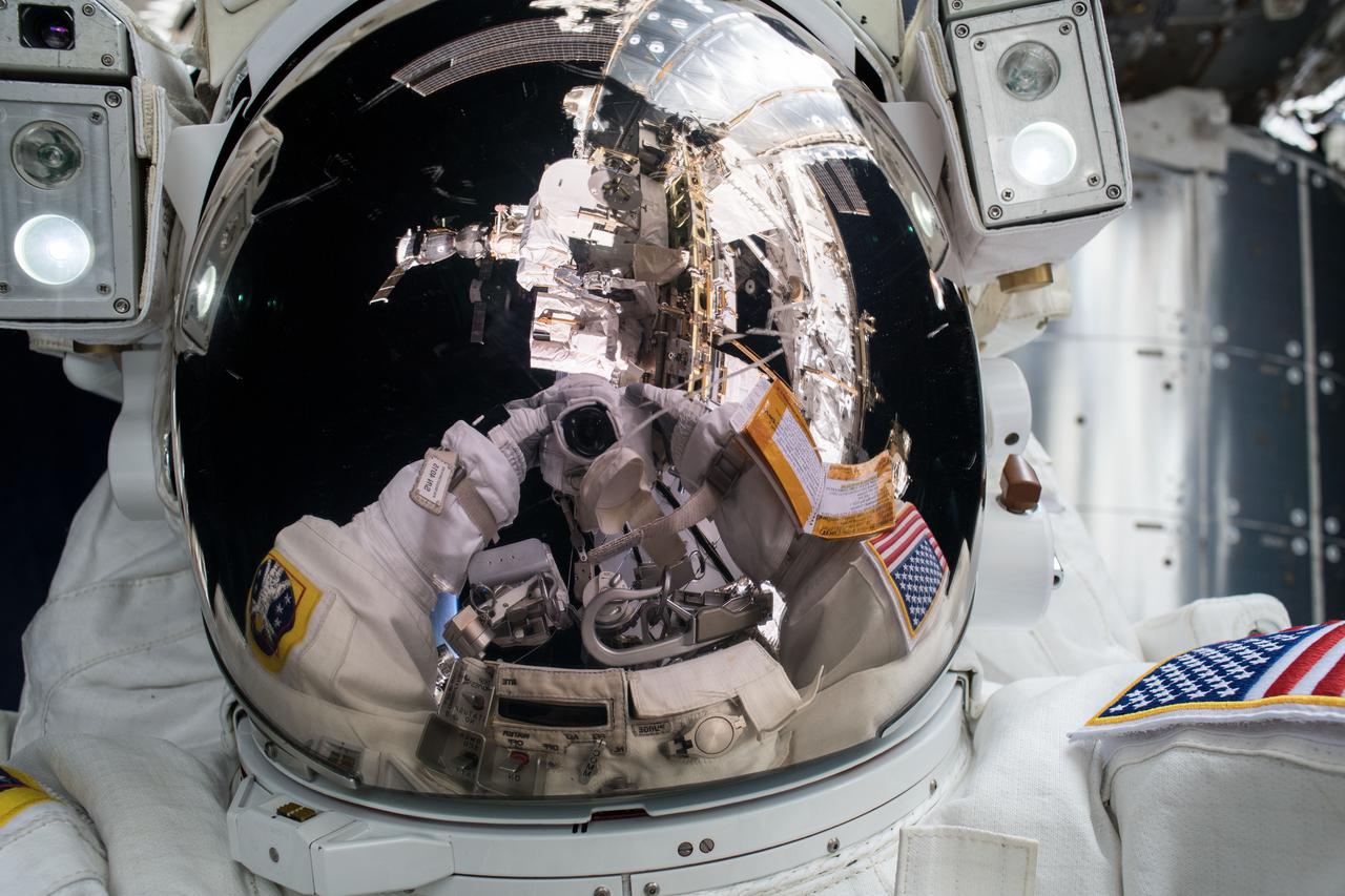 iss054e047709 (Feb. 16, 2018) --- NASA astronaut and Expedition 54 Flight Engineer Mark Vande Hei takes a "space-selfie" during a spacewalk with astronaut Norishige Kanai (out of frame) of the Japan Aerospace Exploration Agency (JAXA). The duo spent nearly six hours servicing components on the Canadarm2 robotic arm.