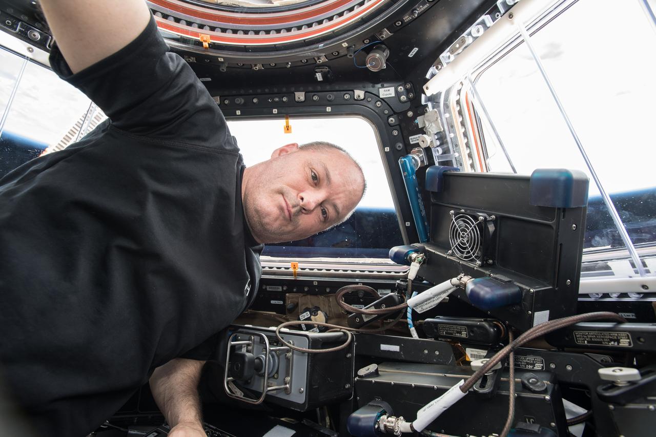 iss055e002983 (March 18, 2018) --- NASA astronaut Scott Tingle is inside the International Space Station's window to the world, the seven-windowed cupola, where astronauts operate the Canadarm2 robotic arm to capture visiting vehicles such as the SpaceX Dragon, the Orbital ATK Cygnus and Japan's H-II Transfer Vehicle.
