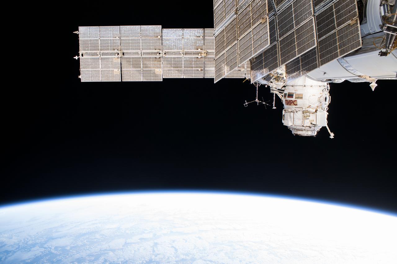 iss055e006234 (March 29, 2018) --- The Russian segment of the International Space Station is photographed as the complex orbited off the northwest coast of Spain. The dominant Russian segment features seen in this picture include the Pirs docking compartment and the solar arrays belonging to the Zarya and Zvezda modules.