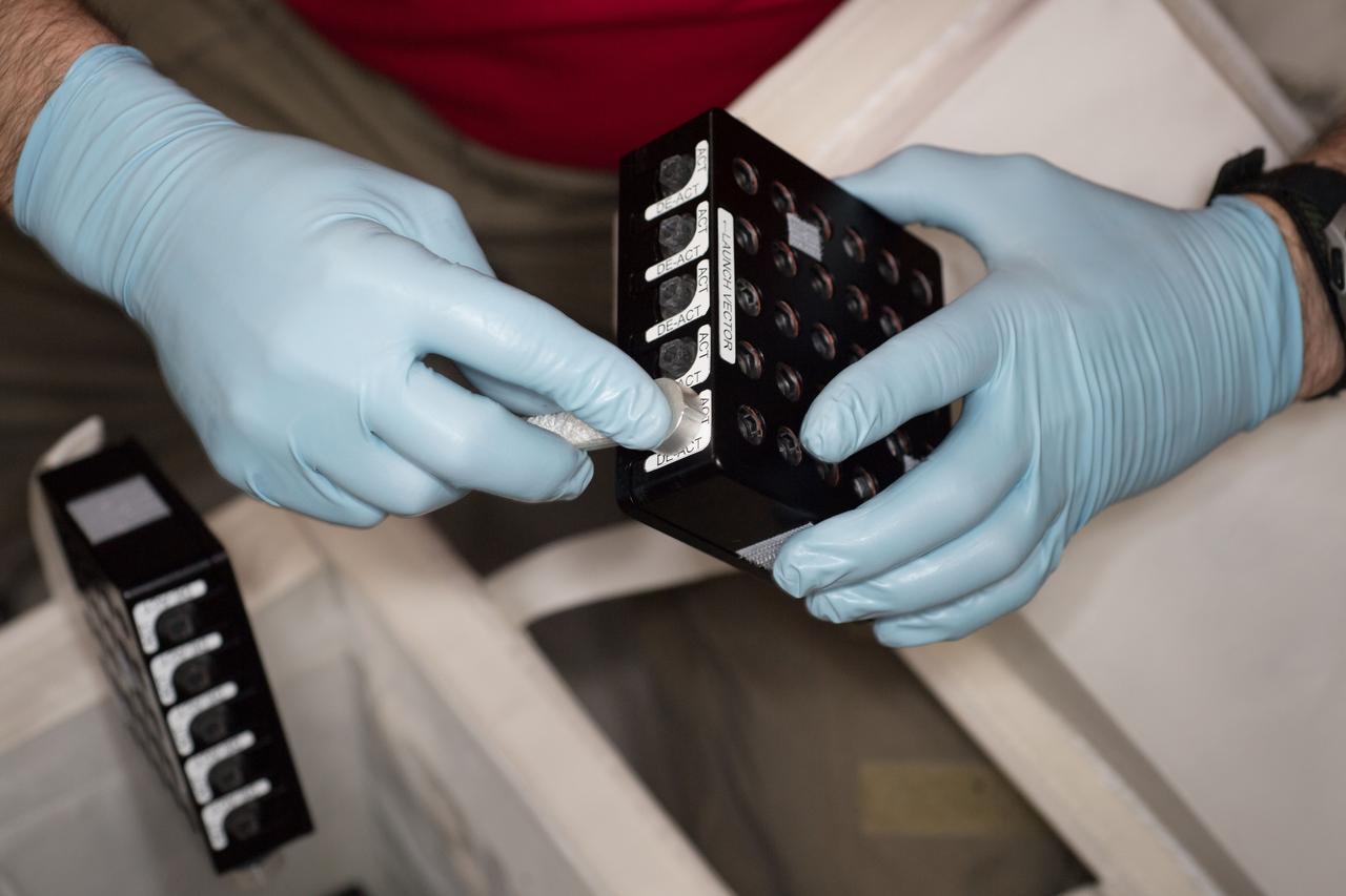 iss055e010761 (4/5/2018) --- Photographic documentation of CASIS Protein Crystal Growth (PCG) -11 hardware during CS-DCB-Unpack2 activity aboard the International Space Station (ISS). Neutron Crystallographic Studies of Human Acetylcholinesterase for the Design of Accelerated Reactivators (CASIS PCG 11) produces acetylcholinesterase crystals, a neurotransmitter enzyme. Crystals grown in microgravity are larger, of higher-quality and can be used for a technique called macromolecular neutron crystallography (MNC) to locate hydrogen atoms in the crystal’s structure.