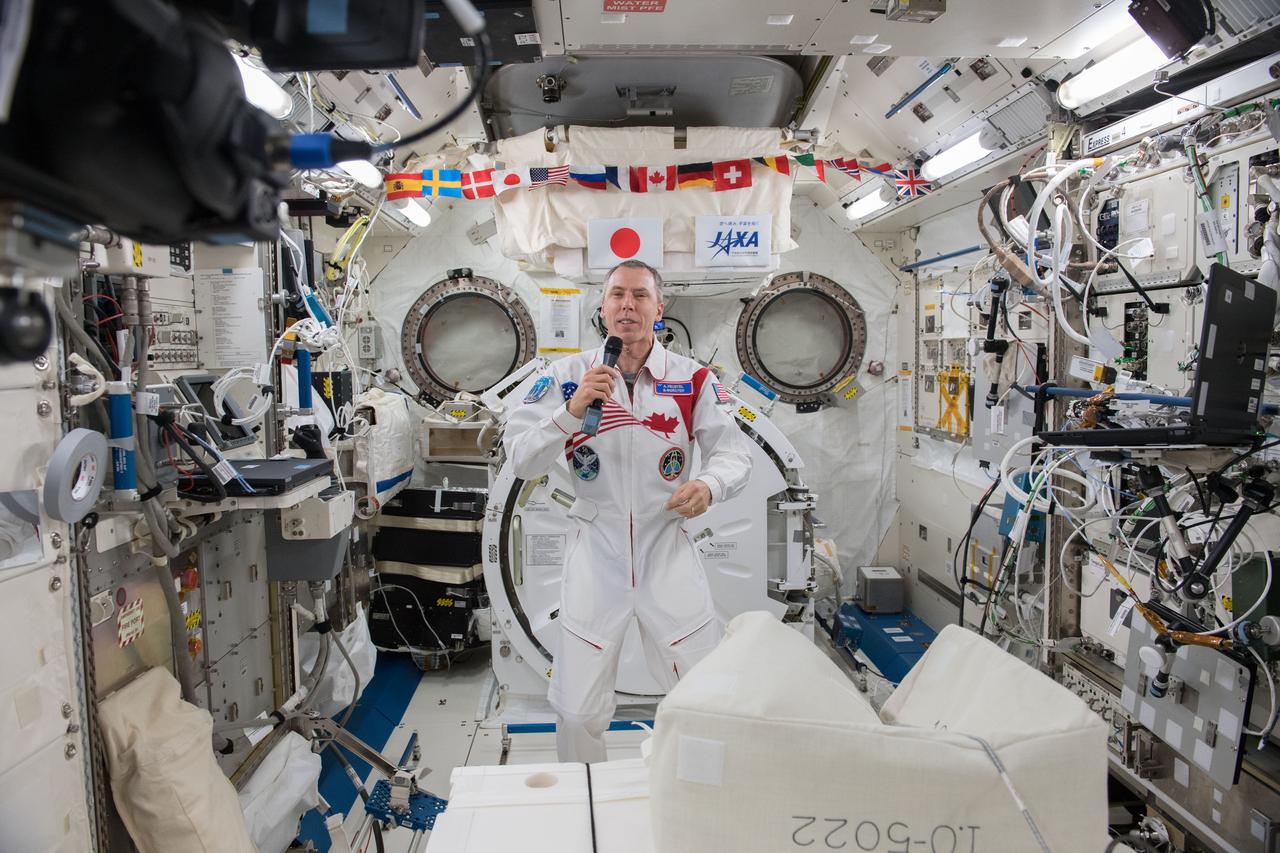 iss055e016074 (April 6, 2018) --- Expedition 55 Flight Engineer Drew Feustel of NASA is inside the Japanese Kibo laboratory module talking to dignitaries on Earth, including university officials, musicians and scientists, during an educational event that took place at Queen's University in Kingston, Ontario.