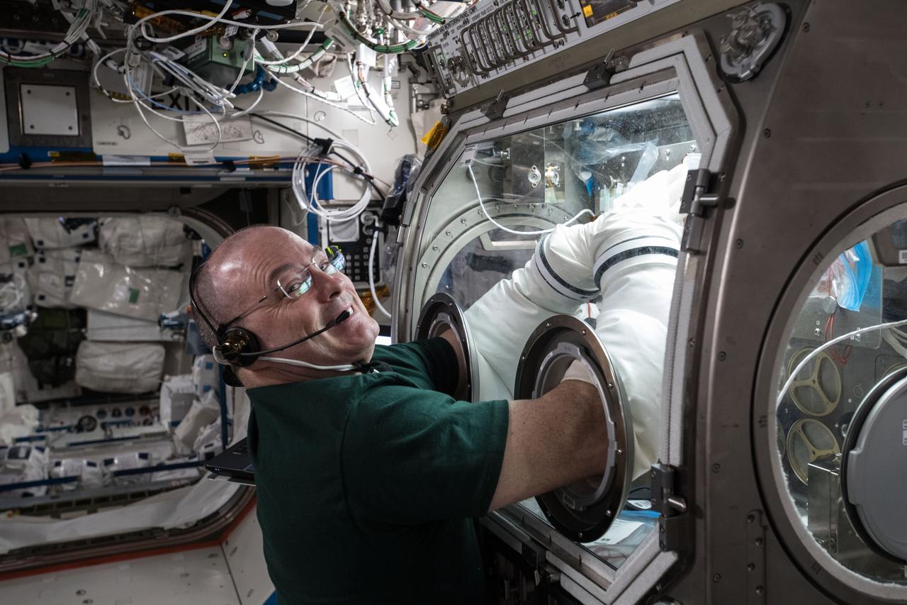 iss055e018653 (April 11, 2018) --- NASA astronaut Scott Tingle performs research operations with the Microgravity Sciences Glovebox inside the U.S. Destiny laboratory module.  Tingle was working on the Metabolic Tracking experiment that looks at a particular type of medicine and how it interacts with human tissue cultures. Results could improve therapies in space and lead to better, cheaper drugs on Earth.