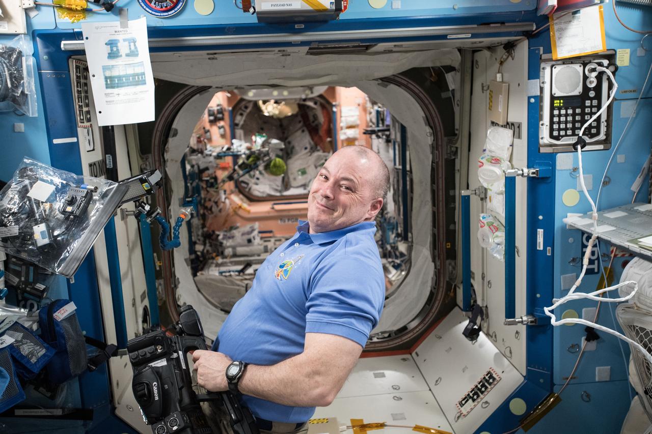 iss055e018690 (April 11, 2018) --- NASA astronaut Scott Tingle prepares video equipment for a series of education videos being recorded for the STEMonstration campaign which demonstrates scientific concepts in space for students and teachers.