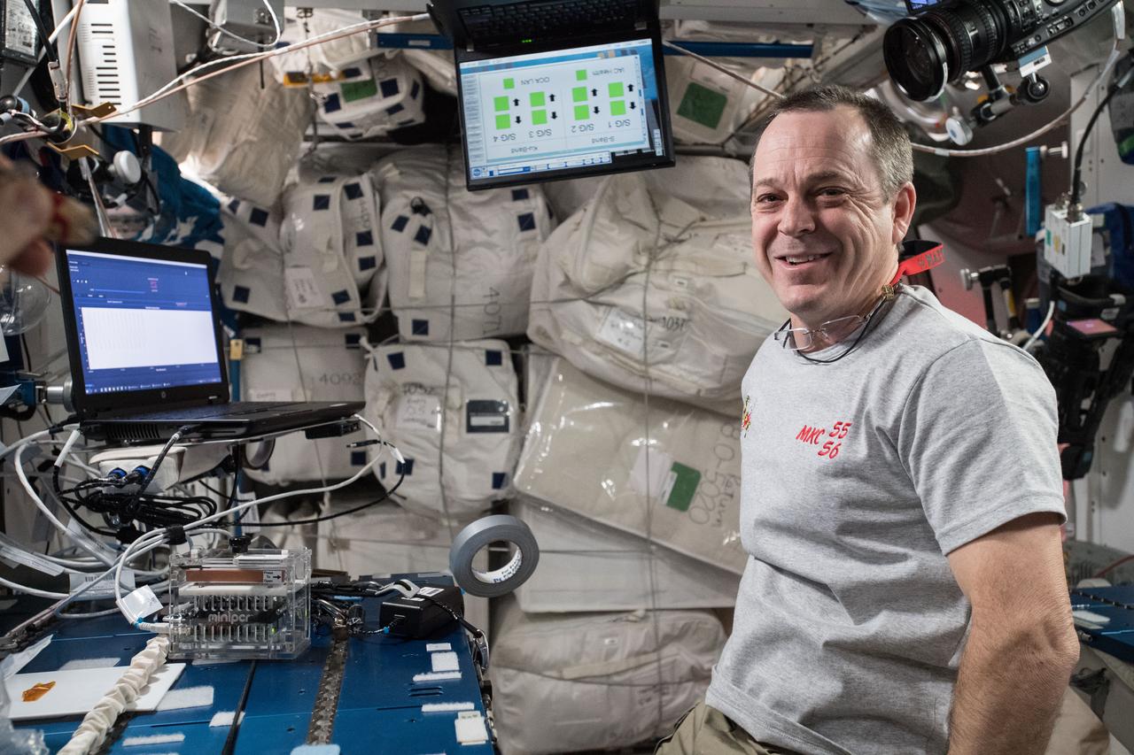 iss055e020319 (April 13, 2018) --- Flight Engineer Ricky Arnold processes of samples inside the Miniature Polymerase Chain Reaction (miniPCR) for the Genes In Space-5 experiment. The research gathered from Genes in Space-5 may be valuable in the development of procedures to maintain astronaut health and prevent an increased risk of cancer on deep space missions. The investigation also provides a deeper understanding of the human immune system, while giving student researchers a direct connection to the space program and offering hands-on educational experiences on Earth and promoting involvement in STEM fields.