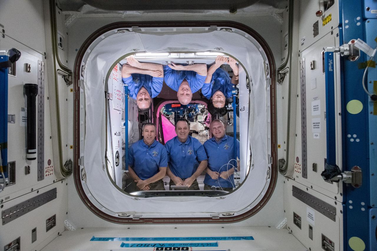 iss055e054608 (May 5, 2018) --- The six-member Expedition 55 crew poses inside the Harmony module which links both the Japanese Kibo and the European Columbus laboratory modules. In the bottom row from left, are Soyuz MS-08 crew members Drew Feustel, Ricky Arnold and Oleg Artemyev. In the top row from left, are Soyuz MS-07 crew members Anton Shkaplerov, Scott Tingle and Norishige Kanai. Feustel, Arnold and Tingle represent NASA. Artemyev and Shkaplerov represent Roscosmos. Kanai represents the Japan Aerospace Exploration Agency.
