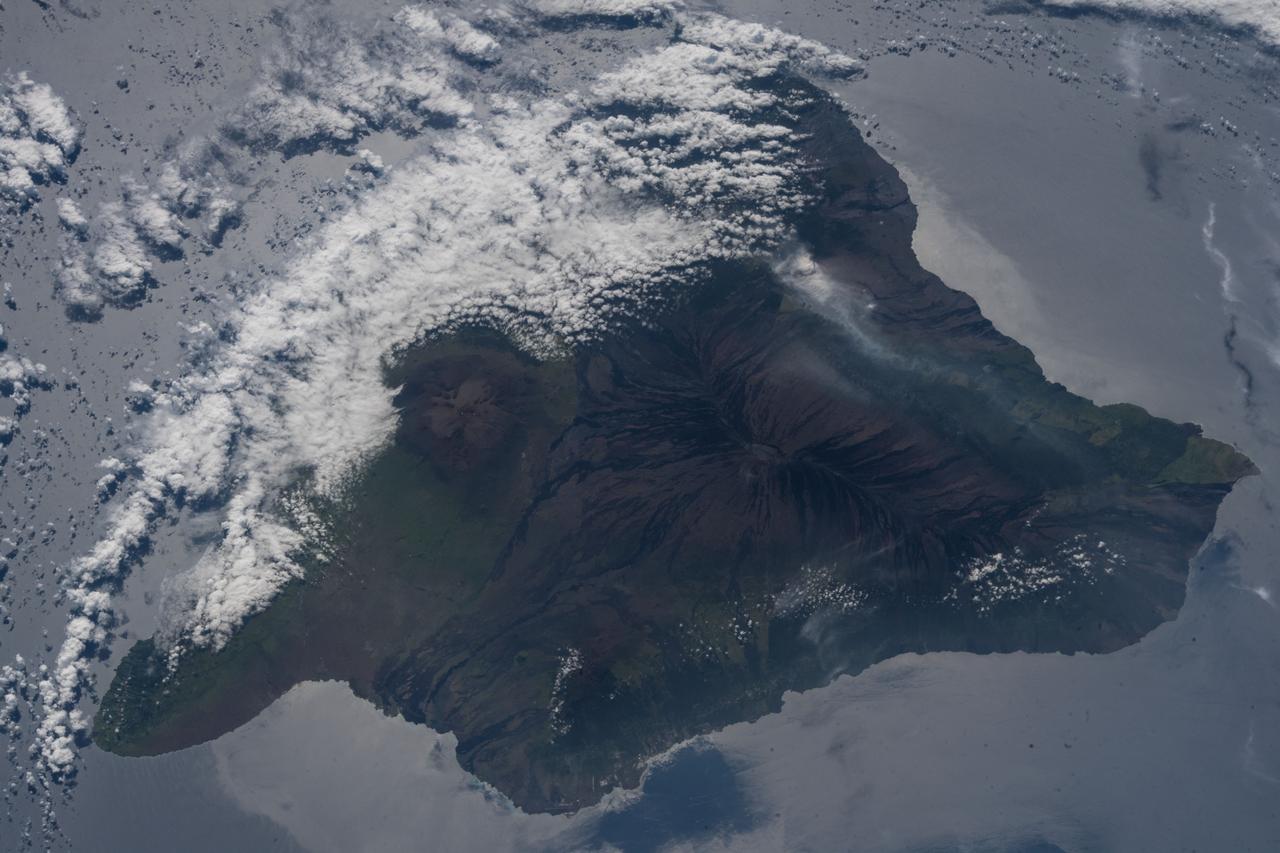 iss055e070297 (May 12, 2018) --- The volcanic ash plume from Mount Kilauea is seen just inland off the eastern coast of Hawaii's Big Island.