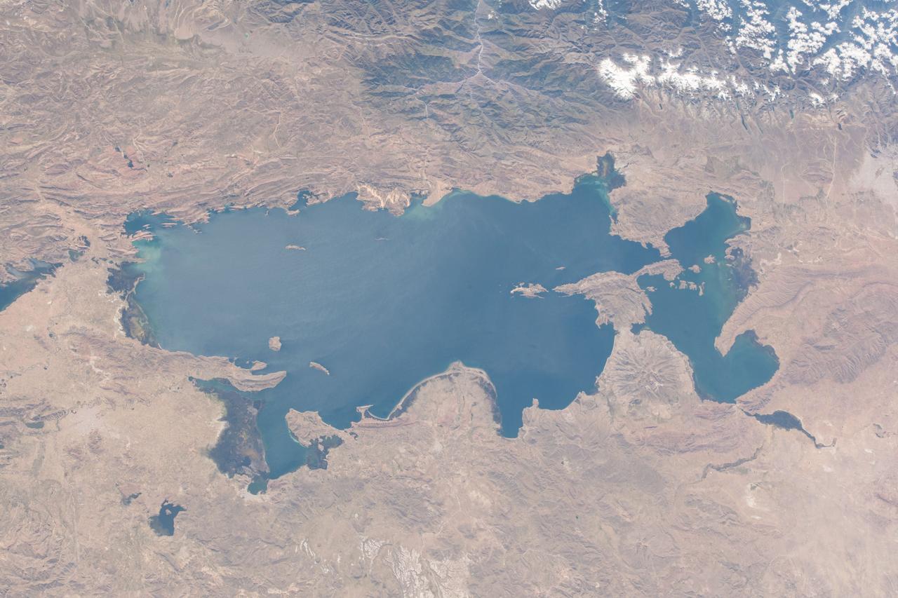 iss055e071030 (May 14, 2018) --- Lake Titicaca is bisected by the South American countries of Peru and Bolivia with the Andes Mountain range skirting up against its northwestern edge.