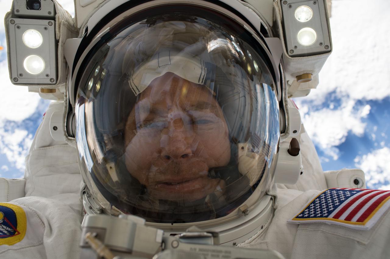 iss055e071274 (May 16, 2018) --- Astronaut Drew Feustel takes an out-of-this-world selfie, or "space-selfie," during a spacewalk on May 16 to swap thermal control gear.