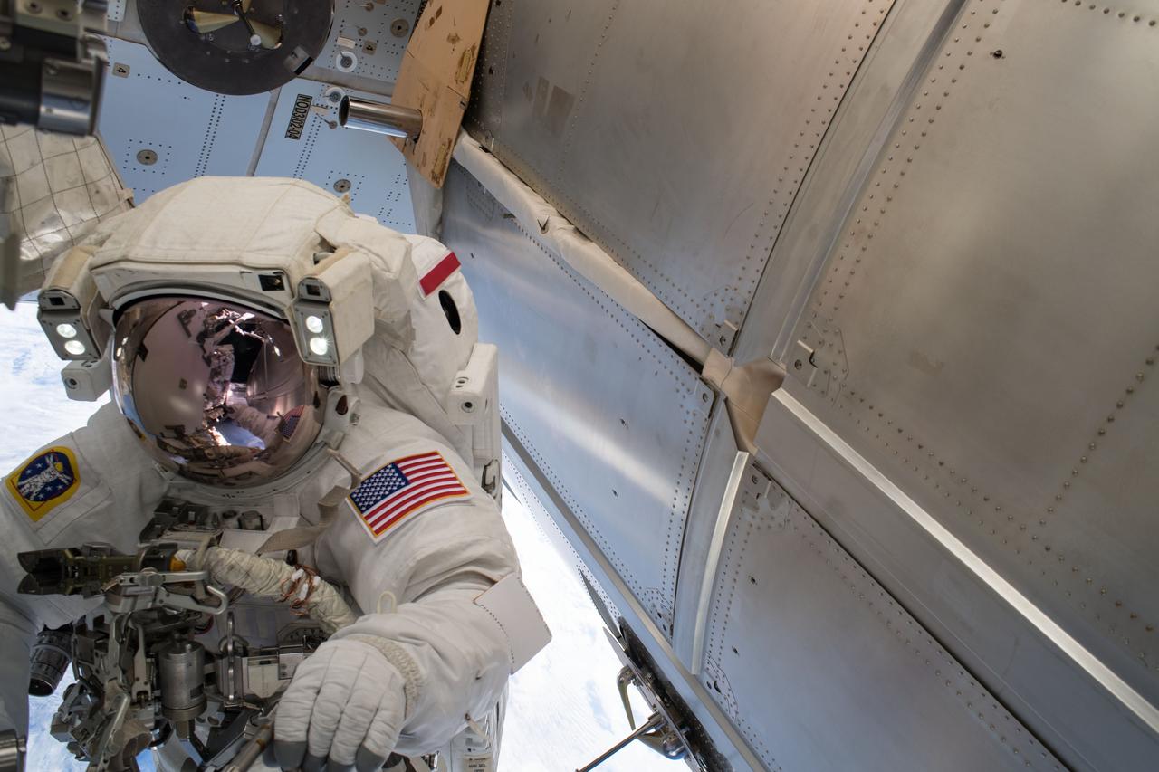 iss055e071438 (May 16, 2018) --- Astronaut Drew Feustel is pictured outside of the Tranquility module during a spacewalk on May 16 to swap thermal control gear.