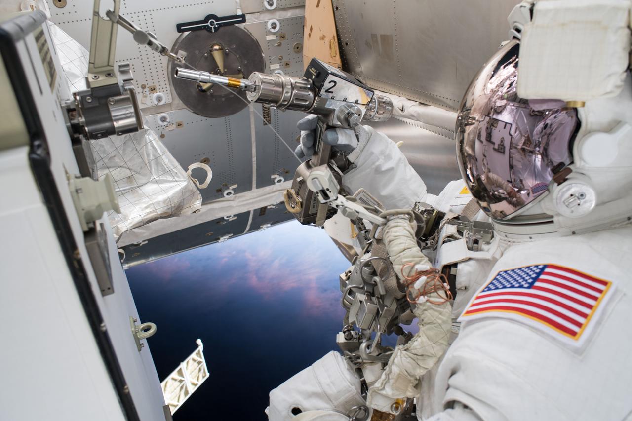 iss055e071458 (May 16, 2018) --- Astronaut Drew Feustel is pictured outside of the International Space Station during a spacewalk on May 16 to swap thermal control gear.