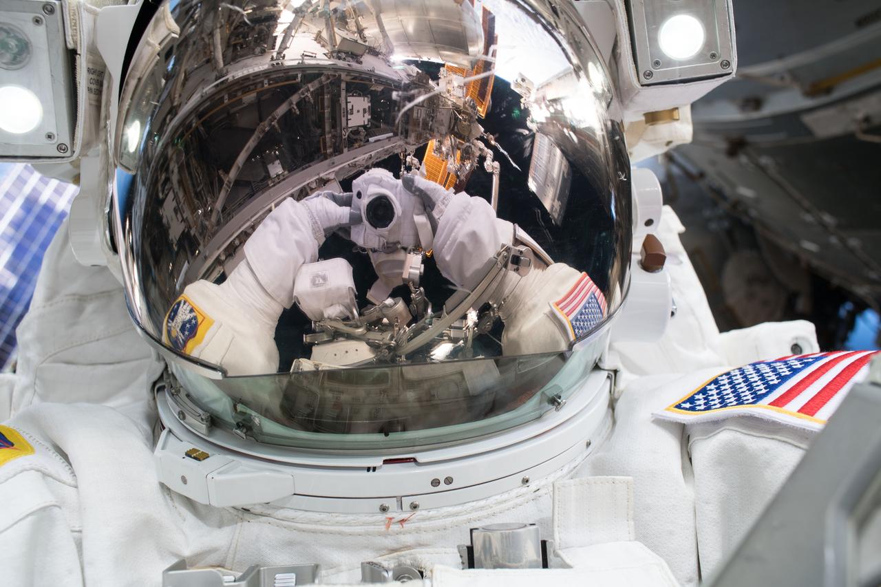 iss055e071506 (May 16, 2018) --- Astronaut Ricky Arnold takes an out-of-this-world selfie, or "space-selfie," during a spacewalk on May 16 to swap thermal control gear.