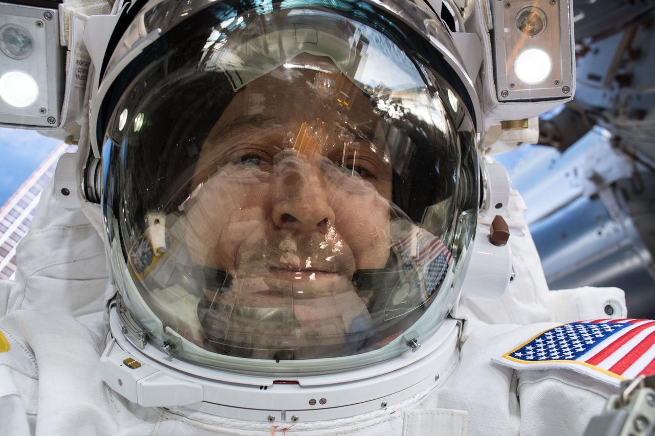 iss055e071274 (May 16, 2018) --- Astronaut Ricky Arnold takes an out-of-this-world selfie, or "space-selfie," during a spacewalk on May 16 to swap thermal control gear.