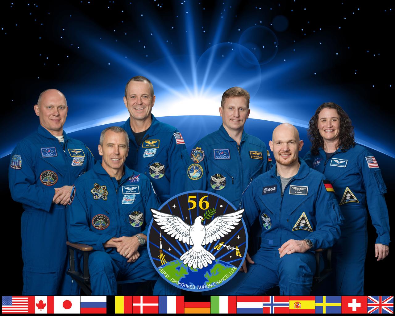 iss056-s-002 (March 8, 2018) --- The official portrait of the Expedition 56 crew. In the front row from left are astronauts Drew Feustel of NASA and Alexander Gerst of the European Space Agency. In the rear from left are crew members Oleg Artemyev of Roscosmos, Ricky Arnold of NASA, Sergei Prokopev of Roscosmos and Serena Auñón-Chancellor of NASA.
