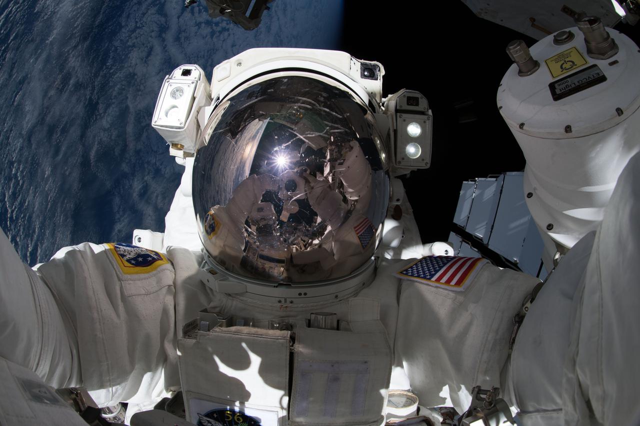 iss056e012002 (June 14, 2018) --- NASA astronaut Ricky Arnold takes an out-of-this-world "space-selfie" during a spacewalk he conducted with fellow NASA astronaut Drew Feustel (out of frame) on June 14, 2018. During the six-hour, 49-minute spacewalk the duo installed high-definition cameras to provide enhanced views of commercial crew spacecraft, including the SpaceX Crew Dragon and the Boeing Starliner, as they approach and dock with the International Space Station.