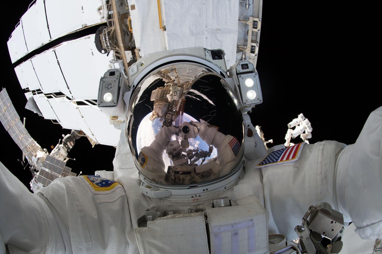 iss056e012043 (June 14, 2018) --- NASA astronaut Ricky Arnold takes an out-of-this-world "space-selfie" during a spacewalk he conducted with fellow NASA astronaut Drew Feustel (out of frame) on June 14, 2018. During the six-hour, 49-minute spacewalk the duo installed high-definition cameras to provide enhanced views of commercial crew spacecraft, including the SpaceX Crew Dragon and the Boeing Starliner, as they approach and dock with the International Space Station.