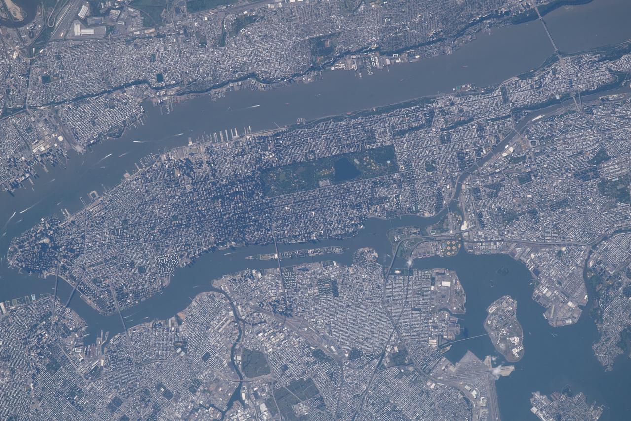iss056e021682 (June 19, 2018) --- The commercial ports of the state of New Jersey and four out of five boroughs that make up New York City, including portions of Brooklyn, Queens, the Bronx and almost all of Manhattan, are pictured from the International Space Station. The Hudson River separates Manhattan from New Jersey. The East River separates Manhattan from Brooklyn and Queens while the Harlem River separates the Bronx from Manhattan.