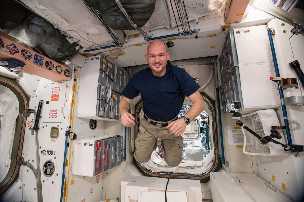 iss056e032027 (June 22, 2018) --- Astronaut Alexander Gerst of the European Space Agency floats inside the Unity module which connects the U.S. segment of the International Space Station to the Russian segment. The Quest airlock and the Tranquility module are also connected to Unity.