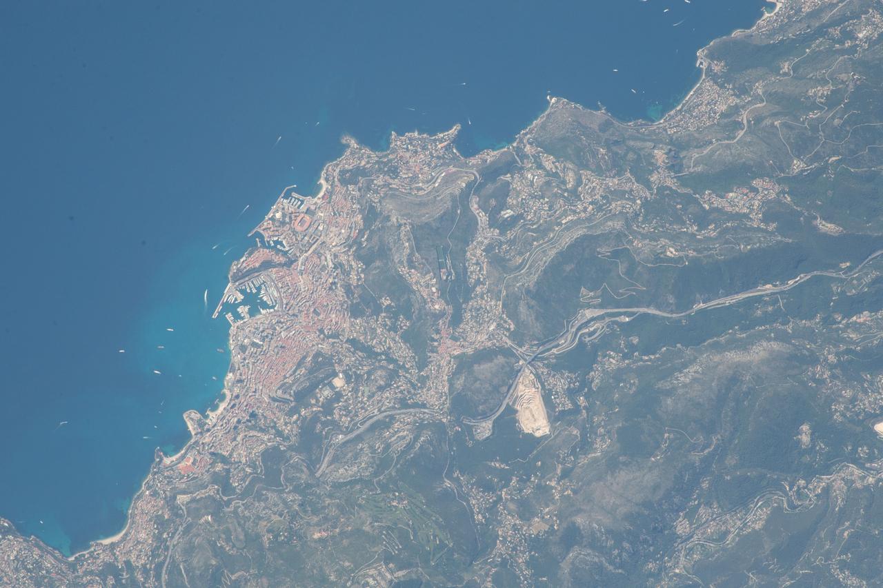 iss056e032555 (June 19, 2018) --- The tiny city-state of Monaco was pictured as the International Space Station orbited over the Mediterranean coasts of Spain, France and Italy. Landmarks in this frame include the district of Monte Carlo, the Louis II Stadium and the Port de Fontvieille.