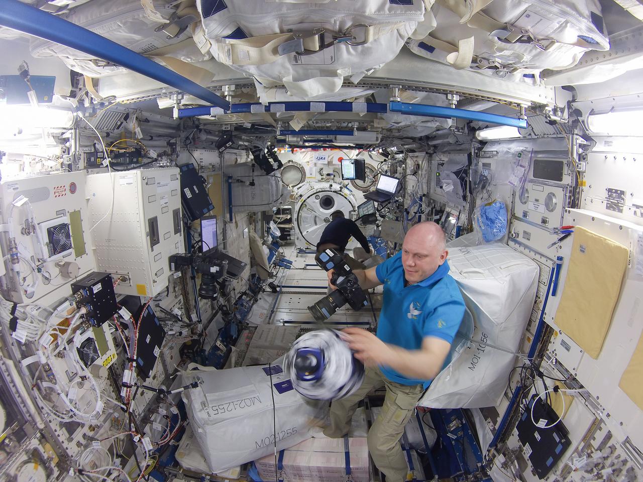 iss056e050302 (6/28/2018) --- Cosmonaut Oleg Artemyev and NASA astronaut Ricky Arnold during the Synchronized Position Hold Engage and Reorient Experimental Satellites (SPHERES) maintenance session two, in the Japanese Experiment Module (JEM) Pressurized Module (JPM).