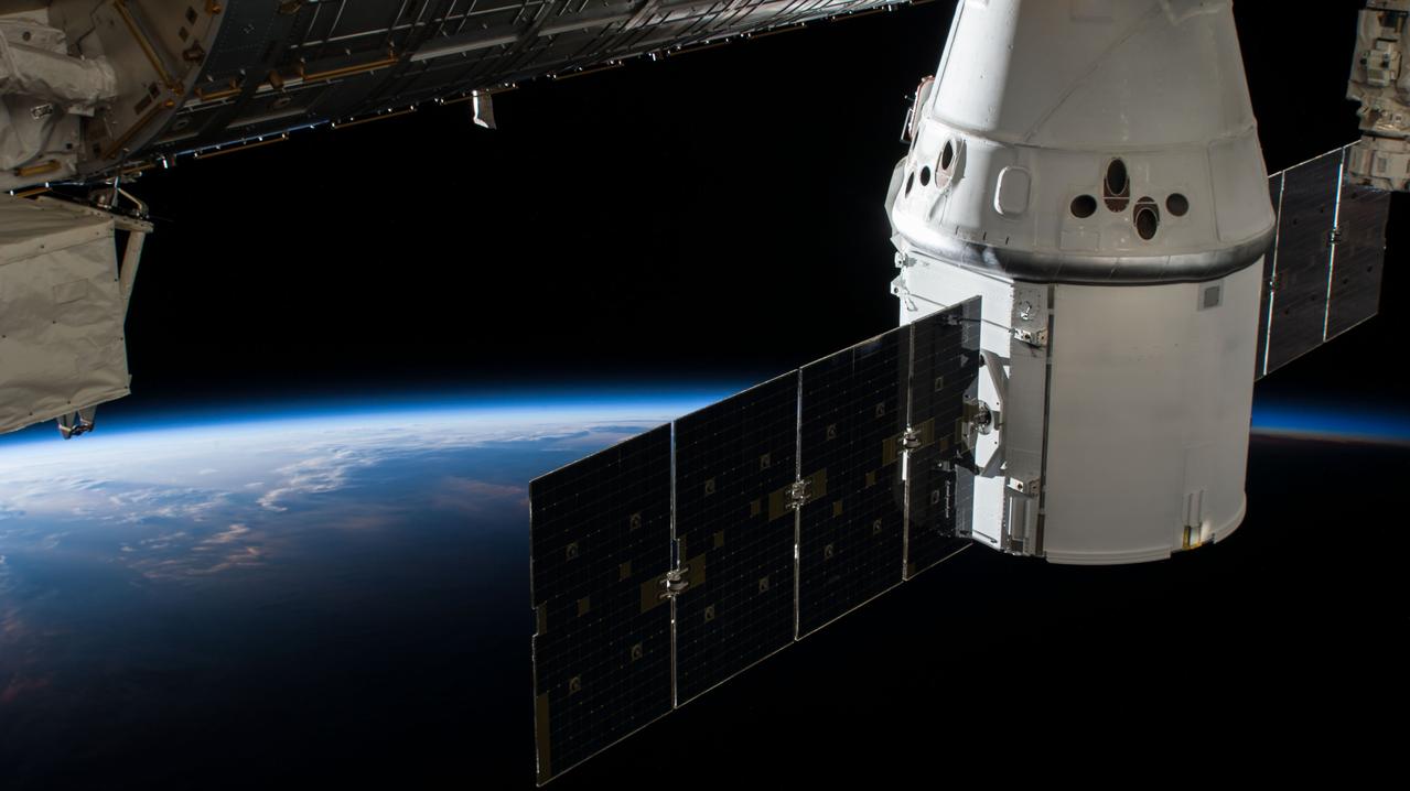 iss056e075978 (July 3, 2018) --- The SpaceX Dragon resupply ship, on its 15th Commercial Resupply Services mission (CRS-15), is pictured attached to the International Space Station the day after it was captured and installed on the Harmony module. The orbital complex was flying over northern central China near the Mongolian border at the time this photograph was taken.
