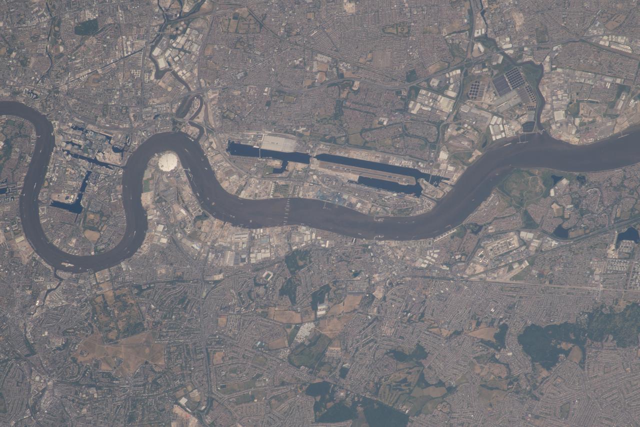 iss056e084656 (June 27, 2018) --- The Canary Wharf financial district, London City Airport and the River Thames in east London, England are pictured as the International Space Station was orbiting across the English Channel.