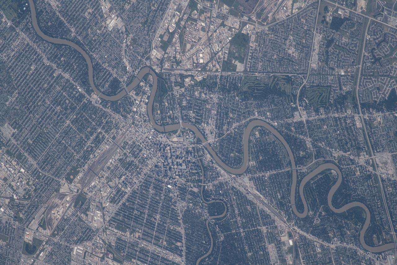iss056e084718 (July 1, 2018) --- The Canadian city of Winnipeg, Manitoba and the Assiniboine and Red Rivers are pictured as the International Space Station was orbiting at the northern-most point of its 51.7-degree orbital inclination.