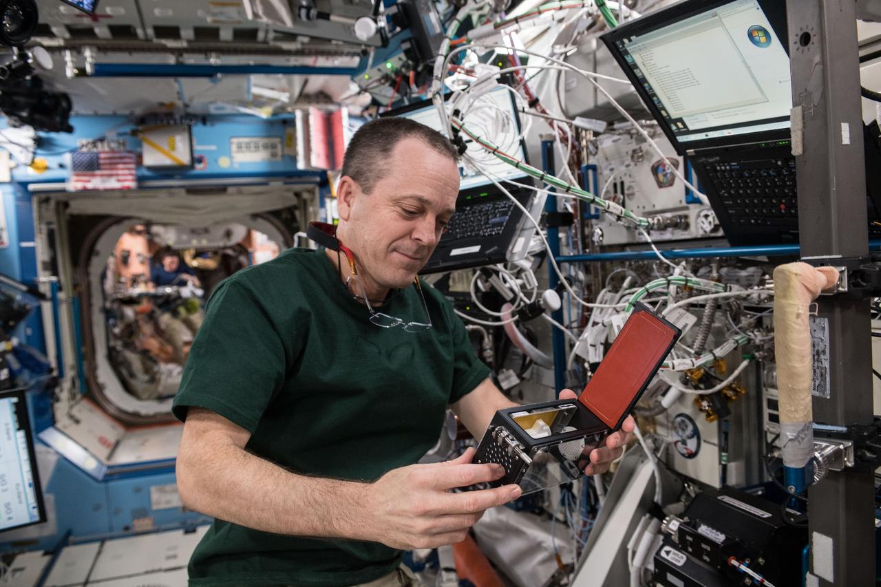 Iss056e095046 (7/13/2018) --- NASA Astronaut Ricky Arnold, working on gear (Bone Densitometer Field Calibration) inside the International Space Station, in support of the Rodent Research 7 (RR7) experiment.