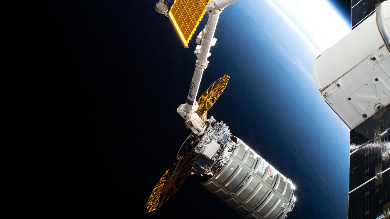 iss056e096531 (July 15, 2018) --- The Cygnus space freighter from Northrop Grumman, formerly Orbital ATK, was pictured July 15 , 2018, poised for release from the Canadarm2 robotic arm back into Earth orbit ending a 52-day cargo mission at the International Space Station.