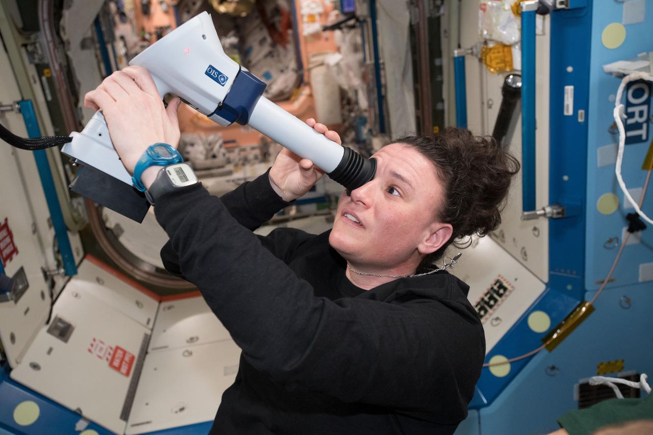 iss056e096896 (July 13, 2018) --- Astronaut Serena Auñón-Chancellor examines her eye with a Fundoscope aboard the International Space Station with remote support from doctors on the ground.