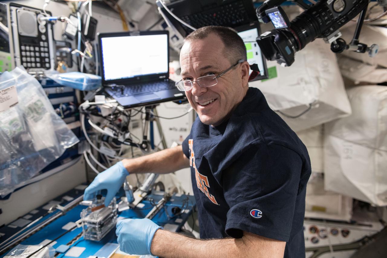 iss056e097419 (July 19, 2018) --- NASA astronaut Ricky Arnold swabbed surfaces in the International Space Station to collect microbe samples. He then processed the microbial DNA using the Biomolecule Sequencer, a device that enables DNA sequencing in microgravity, to identify microbes able to survive in microgravity.