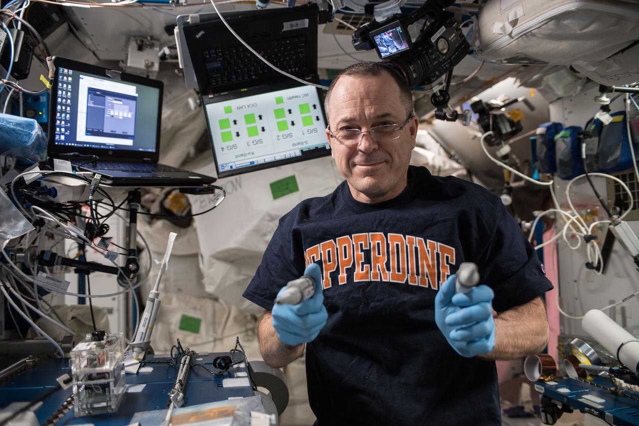 iss056e097429 (July 19, 2018) --- NASA astronaut Ricky Arnold swabbed surfaces in the International Space Station to collect microbe samples. He then processed the microbial DNA using the Biomolecule Sequencer, a device that enables DNA sequencing in microgravity, to identify microbes able to survive in microgravity.