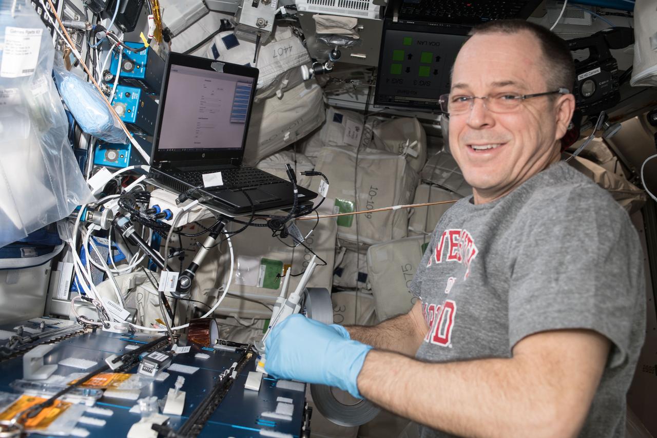 iss056e097518 (July 20, 2018) --- Expedition 56 Flight Engineer Ricky Arnold prepares amplified DNA collected from microbes living aboard the International Space Station for sequencing using the Biomolecule Sequencer. The Biomolecule Extraction and Sequencing Technology (BEST) investigation studies the use of DNA sequencing for the identification of unknown microbial organisms living on the station and to understand how humans, plants and microbes adapt to living in space.