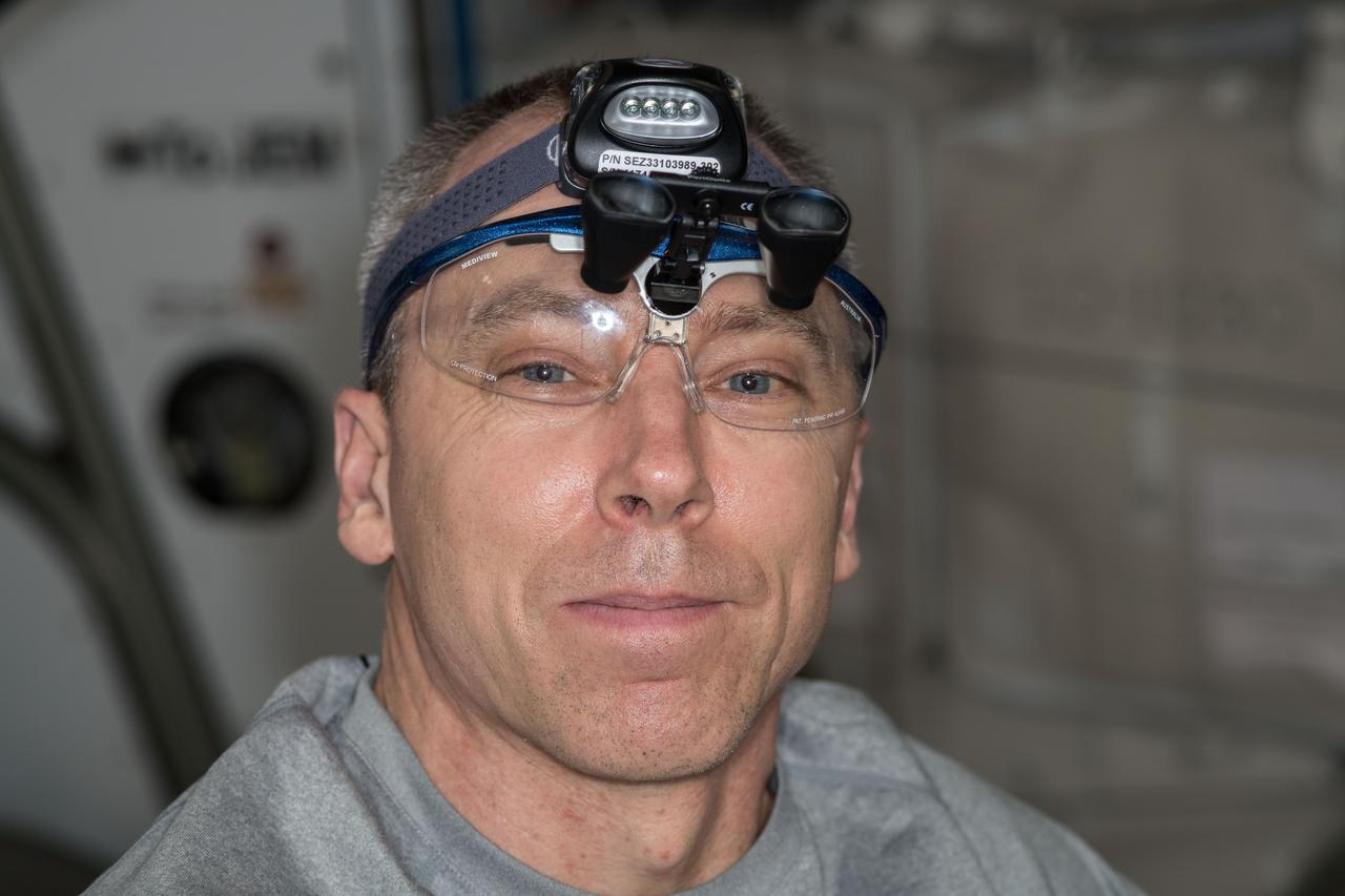 iss056e130411 (Aug. 9, 2018) --- Expedition 56 Commander Drew Feustel pauses for a portrait while he was inspecting hatch seals, parts and surfaces in the U.S. segment of the International Space Station.