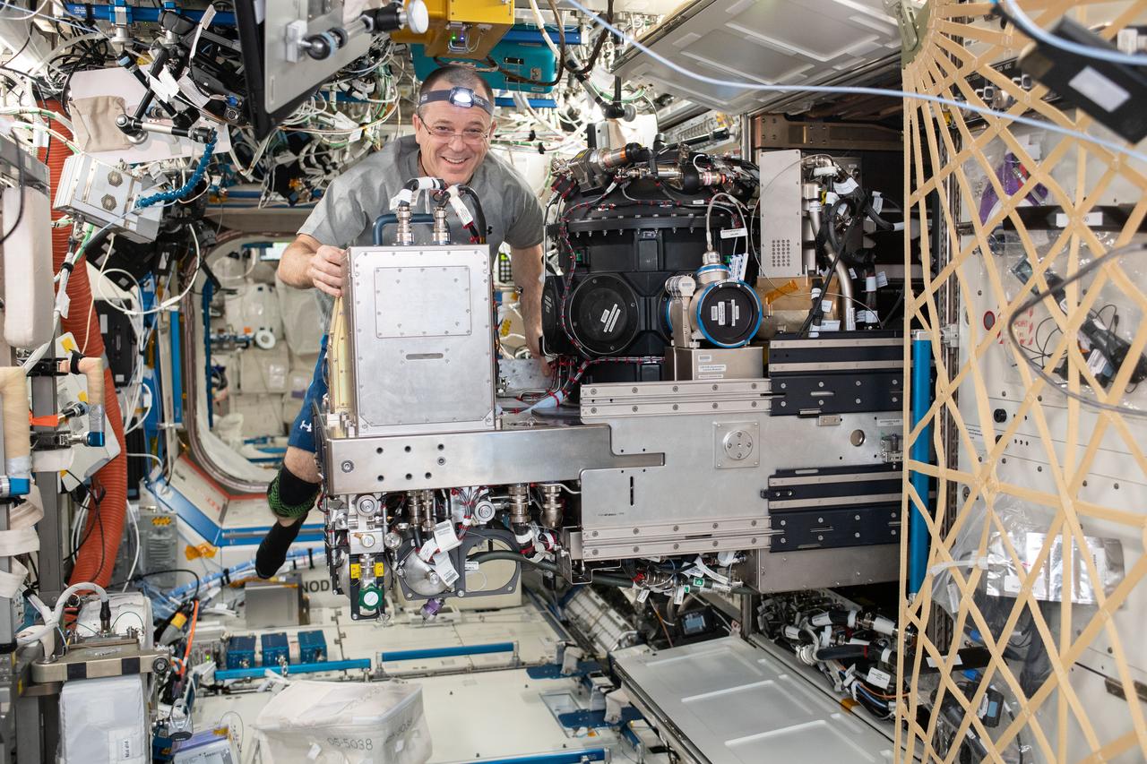 iss056e136571 (Aug. 14, 2018) --- NASA astronaut Ricky Arnold replaces hardware and performs maintenance in the Combustion Integrated Rack facility located in the International Space Station's U.S. Destiny laboratory.