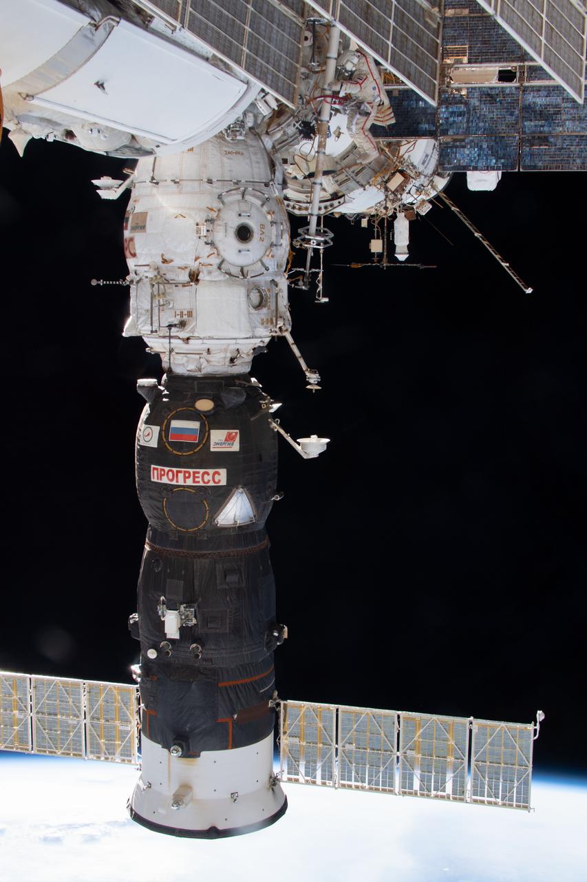 iss056e142697 (8/15/2018) --- A view of Cosmonaut in red-striped Orlan suit, as he works to install Payload “ICARUS” on URM-D work station on PI.II of SM [PO] during ISS Extravehicular Activity 45 (EVA 45). ICARUS is a collaborative project between Roscosmos and the German aerospace center (DLR) to study the migratory patterns of small animals tagged on earth with GPS hardware.